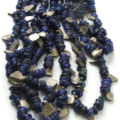 Strings of old blue ring-beads interspaced with silver pendants. Worn by Christian women in Lalibela. Central Ethiopia.