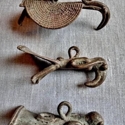 Three bronze pendants of birds; L.9-11cm. Kulango,Ivory Coast