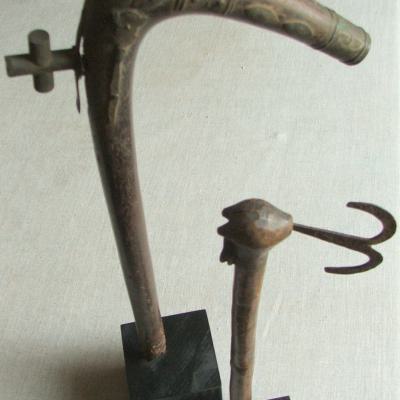 Two ceremonial staffs,the large one from the royal ciry of Abomey. The smaller one is a priest's staff, representing the god Shango. H. 38-46 cm. Fon, Benin.