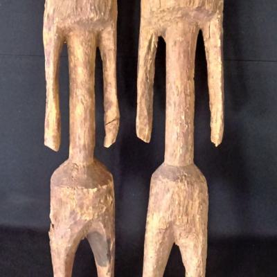 2 Well-worn Moba-figures, used to ward off evil spirits around the courtyard. Height; 56 and 60 cm. Northern-Togo. On a steel socle.